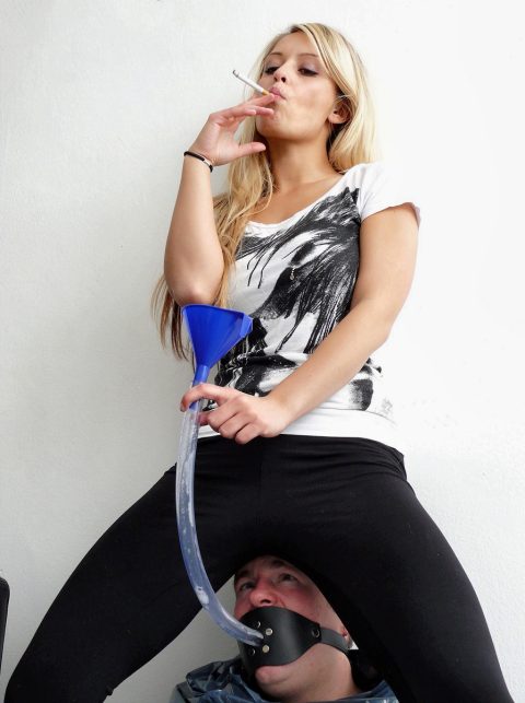 Mean Mistress Janette Sits on Slave's Head and Smokes a Cigarette Then Spits into a Tube Feeding Her Slave Her Saliva - Spitting Femdom and Smoking Fetish